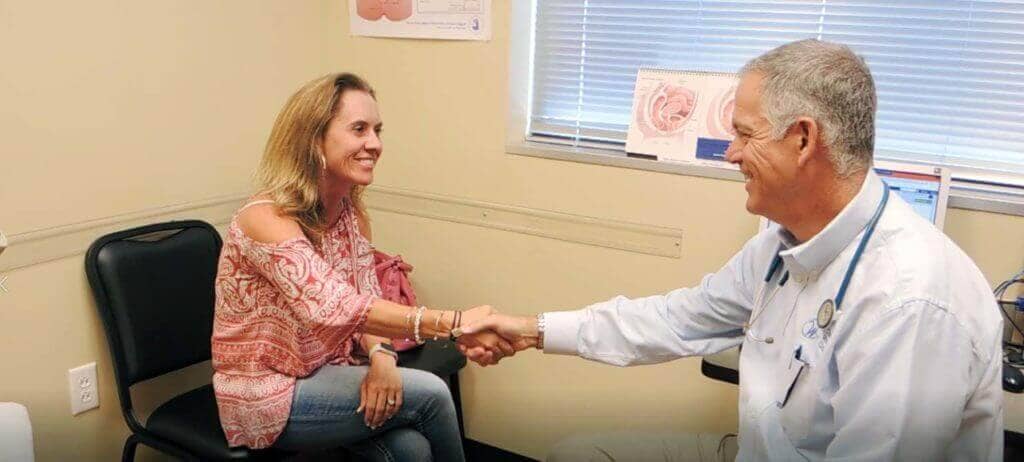 Dr. Jeff Storey of Cheyenne Women's Clinic talks with a patient